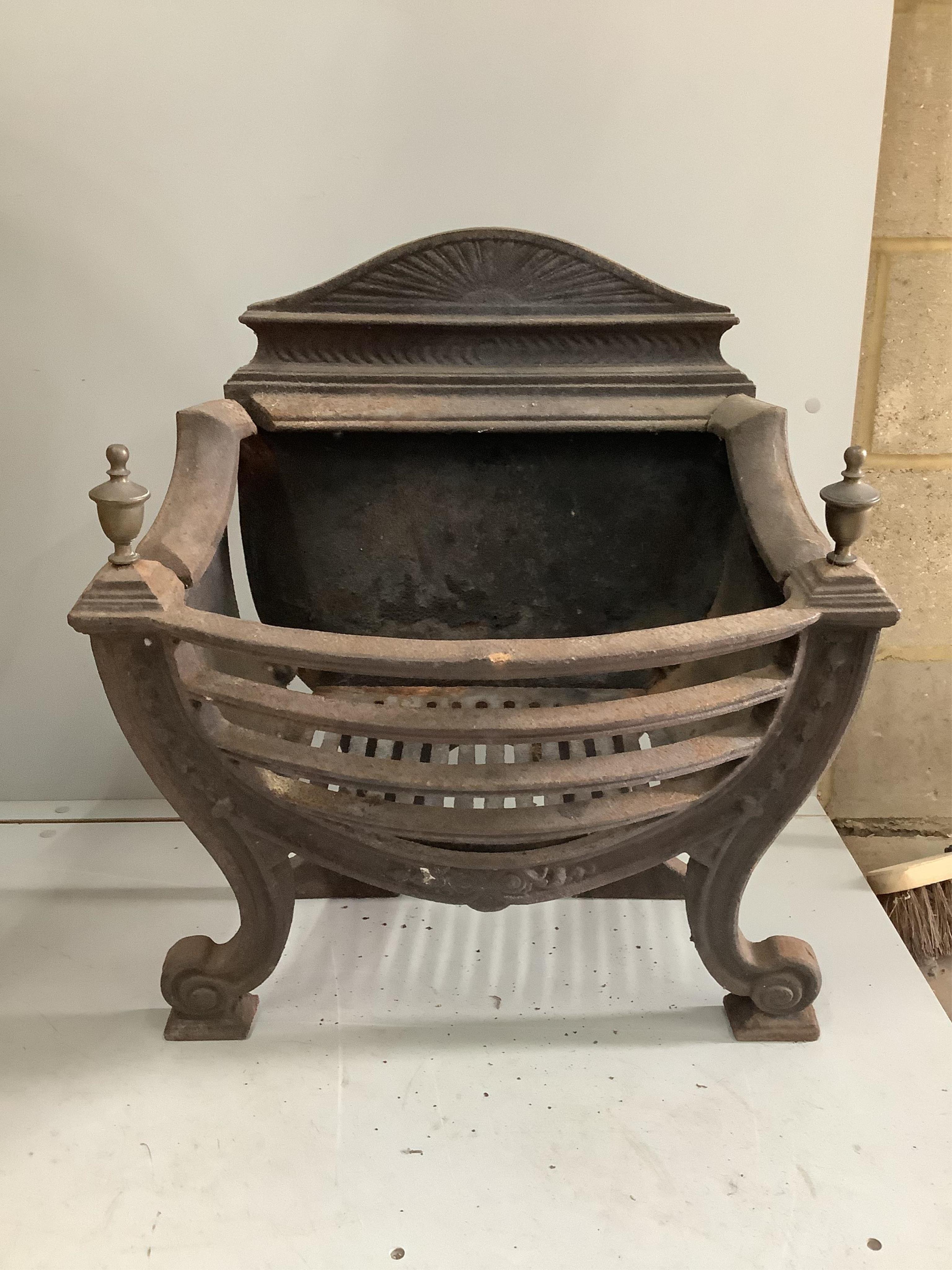 A George III style brass mounted cast iron serpentine fire grate, (lacking side bolts), width 56cm, depth 30cm, height 64cm. Condition - poor